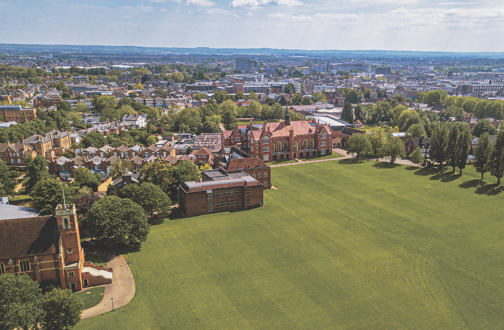 Aerial-shot-of-Bedford-School-showing-its-chapel-playing-fields-with-Bedford-town-in-the-background